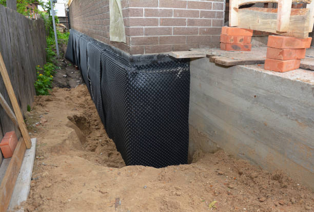 Happy homeowners after waterproofing job in Laketon